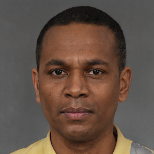 Neutral latino young-adult male with short  brown hair and brown eyes