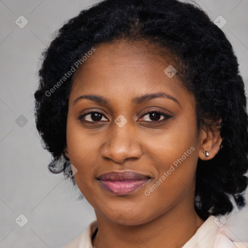 Joyful black young-adult female with medium  black hair and brown eyes