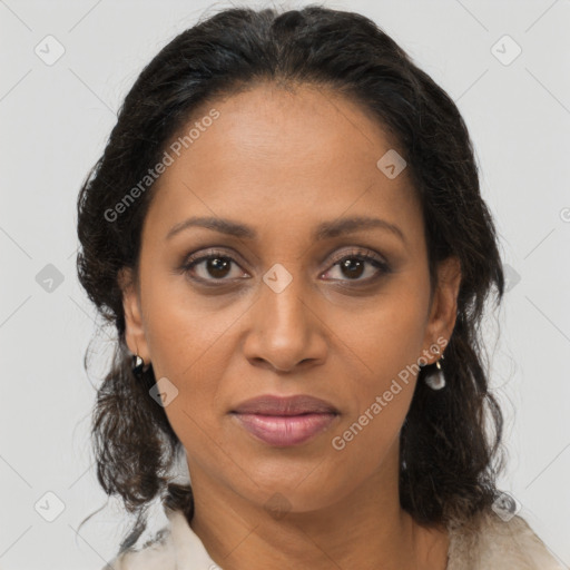 Joyful black adult female with medium  brown hair and brown eyes