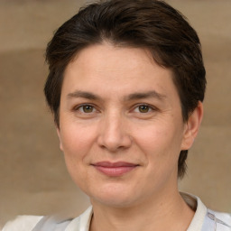 Joyful white adult female with short  brown hair and brown eyes