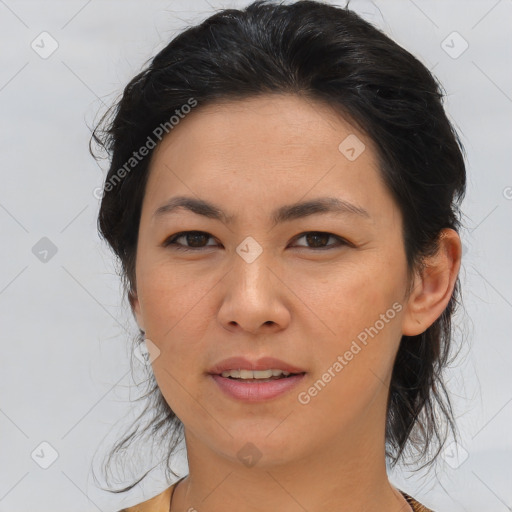 Joyful asian young-adult female with medium  brown hair and brown eyes