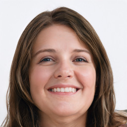 Joyful white young-adult female with long  brown hair and blue eyes