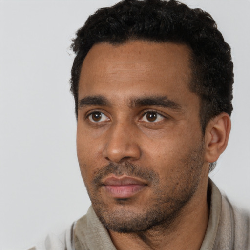 Neutral black young-adult male with short  black hair and brown eyes