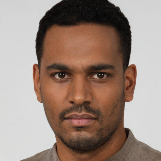 Neutral latino young-adult male with short  black hair and brown eyes