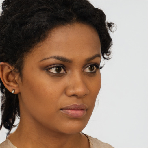 Neutral black young-adult female with short  brown hair and brown eyes