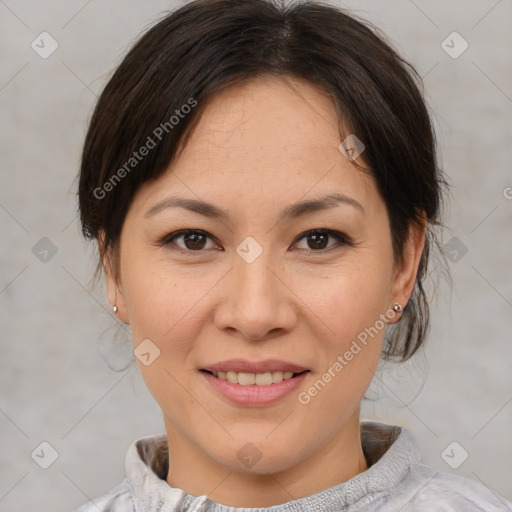 Joyful asian adult female with medium  brown hair and brown eyes