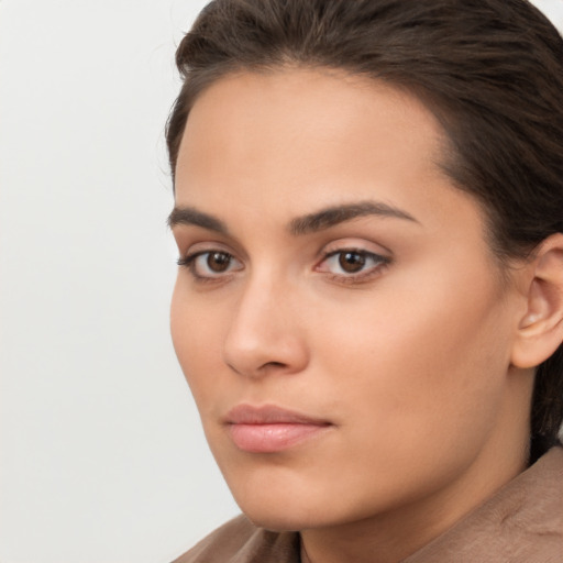 Neutral white young-adult female with short  brown hair and brown eyes