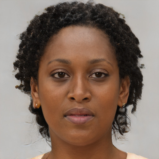 Neutral black adult female with short  brown hair and brown eyes