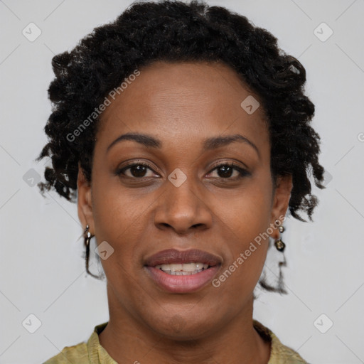 Joyful black adult female with short  brown hair and brown eyes