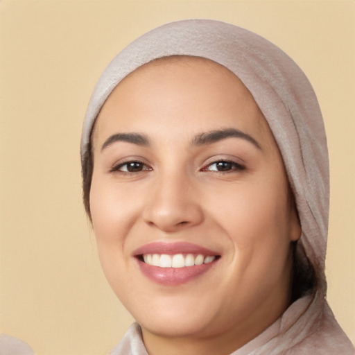 Joyful white young-adult female with short  black hair and brown eyes