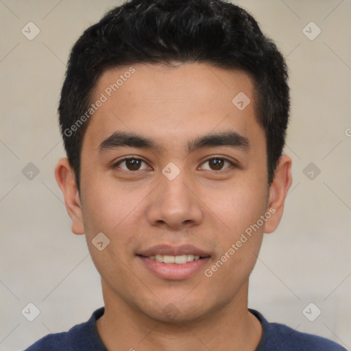 Joyful latino young-adult male with short  black hair and brown eyes