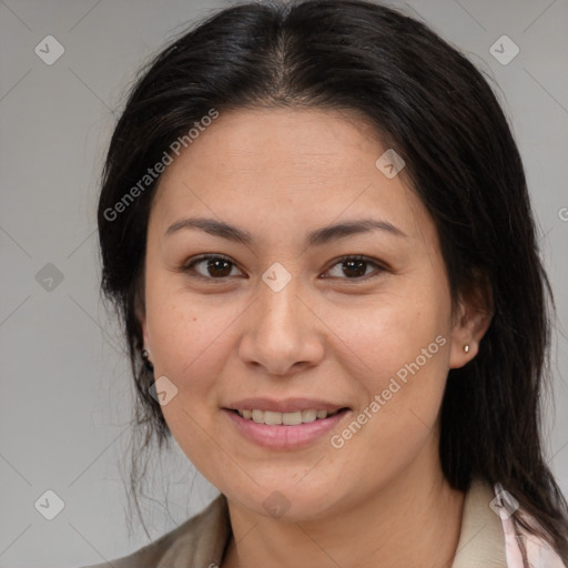 Joyful asian adult female with medium  brown hair and brown eyes