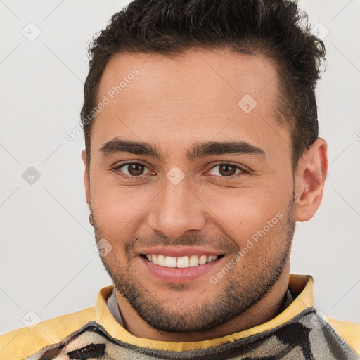 Joyful white young-adult male with short  brown hair and brown eyes