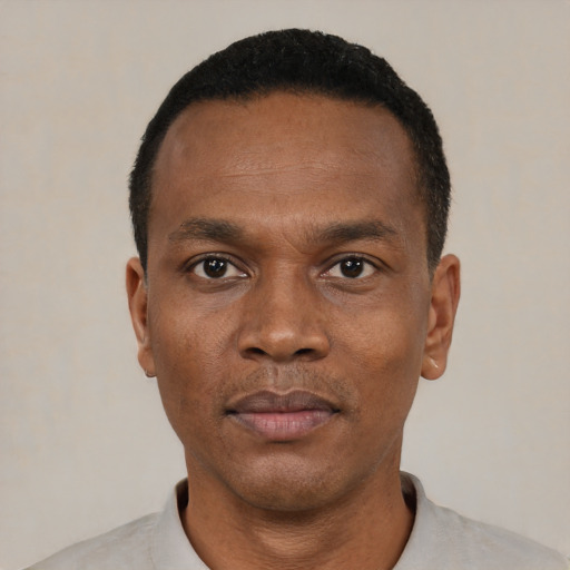 Neutral black adult male with short  black hair and brown eyes