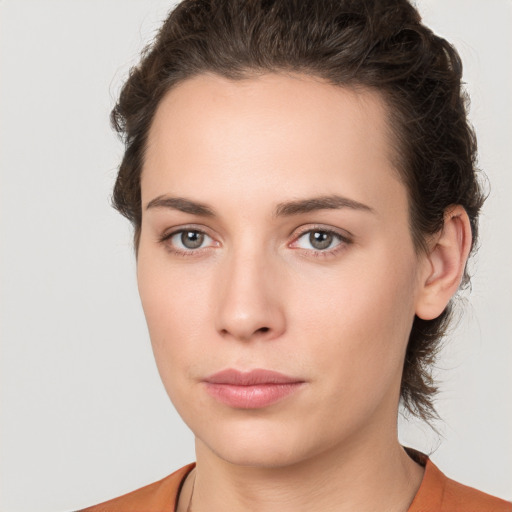 Neutral white young-adult female with medium  brown hair and brown eyes