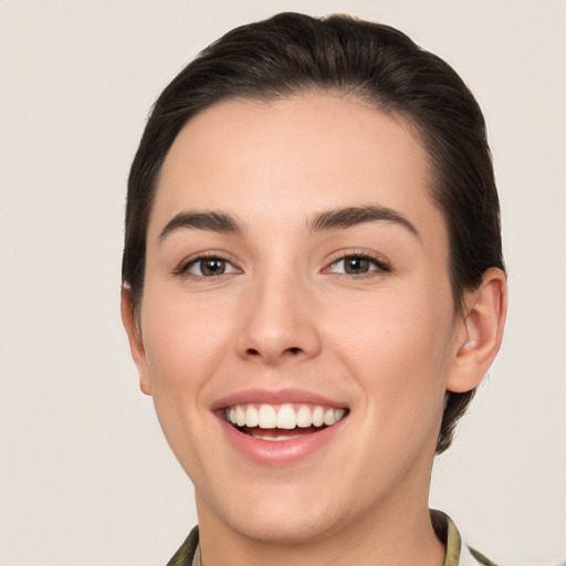 Joyful white young-adult female with medium  brown hair and brown eyes