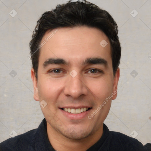 Joyful white young-adult male with short  black hair and brown eyes