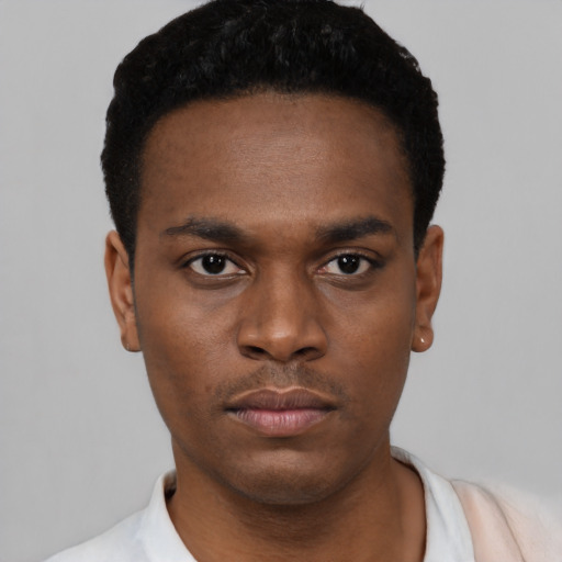Neutral black young-adult male with short  black hair and brown eyes