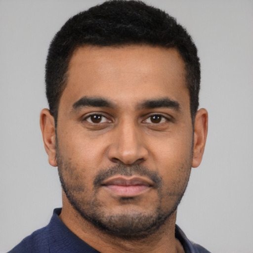 Neutral latino young-adult male with short  black hair and brown eyes