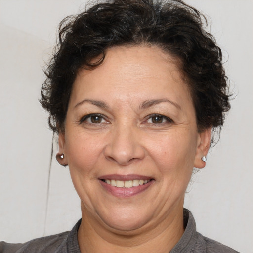 Joyful white adult female with short  brown hair and brown eyes