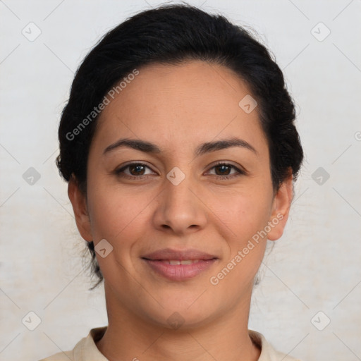 Joyful latino young-adult female with medium  brown hair and brown eyes