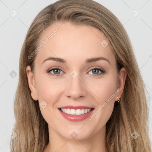 Joyful white young-adult female with long  brown hair and grey eyes