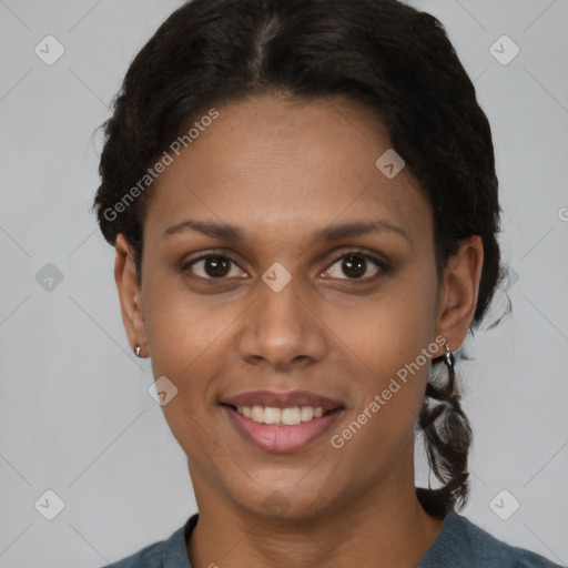 Joyful black young-adult female with short  brown hair and brown eyes