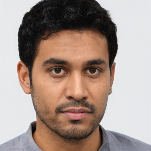 Neutral latino young-adult male with short  brown hair and brown eyes