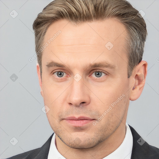 Neutral white adult male with short  brown hair and brown eyes