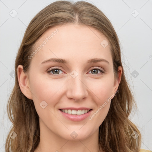 Joyful white young-adult female with long  brown hair and blue eyes