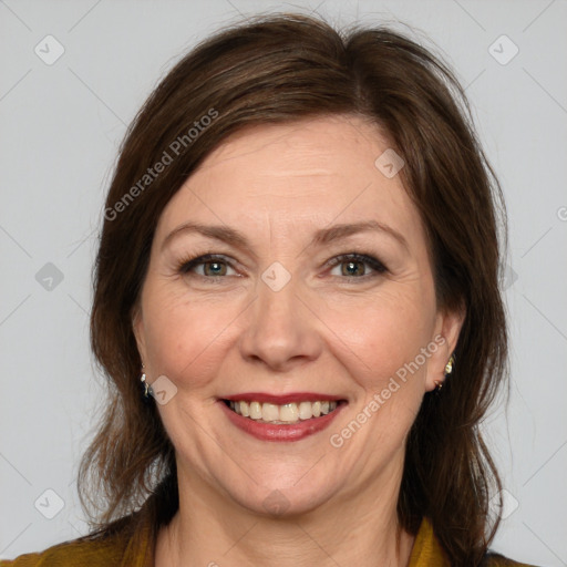 Joyful white adult female with medium  brown hair and brown eyes