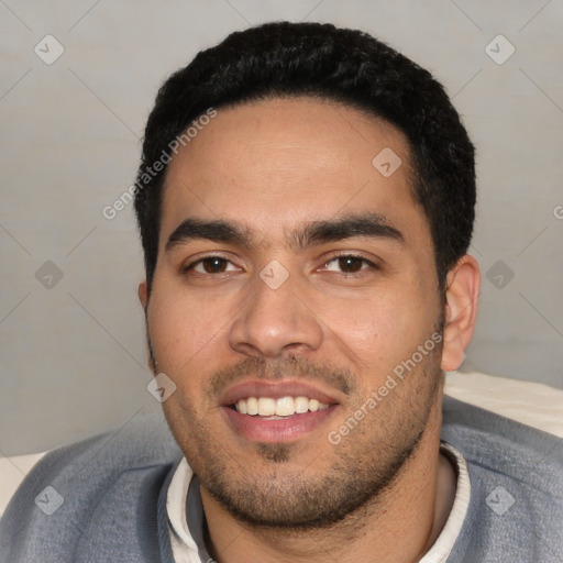 Joyful white young-adult male with short  black hair and brown eyes