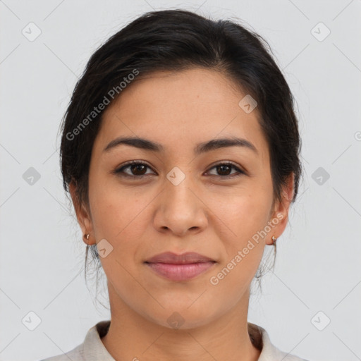 Joyful latino young-adult female with medium  brown hair and brown eyes