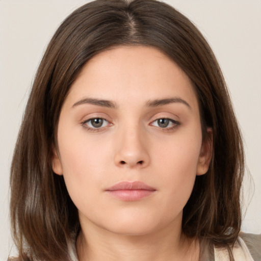 Neutral white young-adult female with medium  brown hair and brown eyes