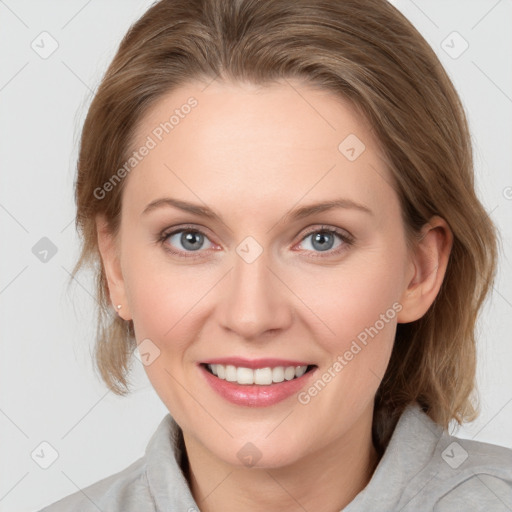 Joyful white young-adult female with medium  brown hair and blue eyes