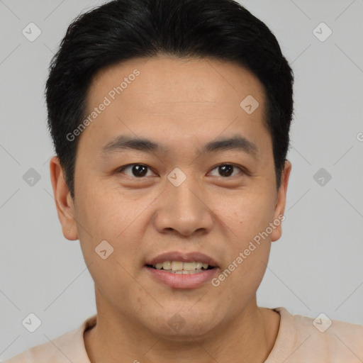 Joyful asian young-adult male with short  black hair and brown eyes