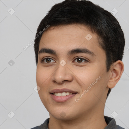 Joyful asian young-adult male with short  black hair and brown eyes