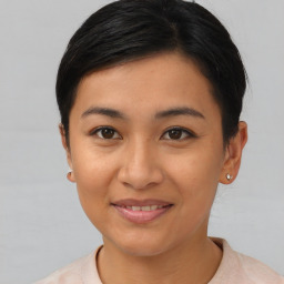 Joyful asian young-adult female with short  black hair and brown eyes