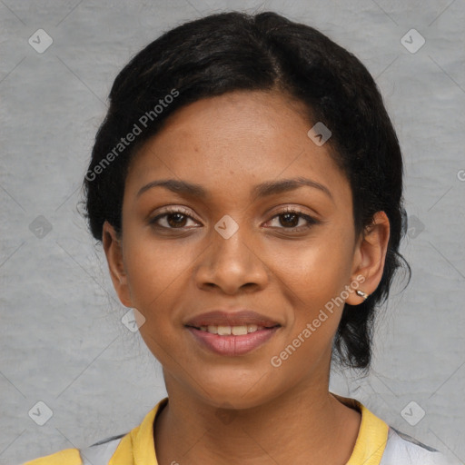 Joyful black young-adult female with short  black hair and brown eyes