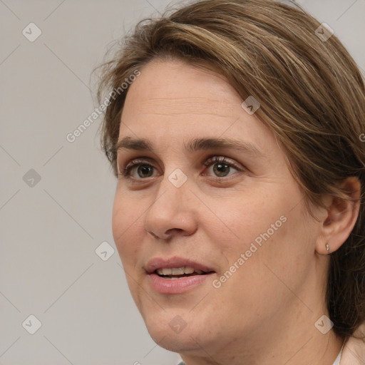 Joyful white adult female with medium  brown hair and grey eyes