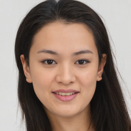 Joyful asian young-adult female with long  brown hair and brown eyes