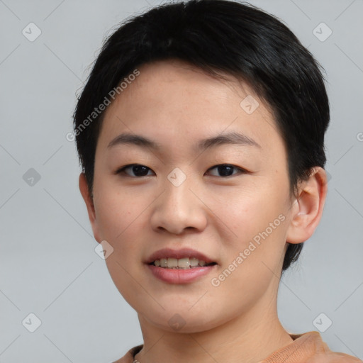 Joyful asian young-adult female with short  black hair and brown eyes