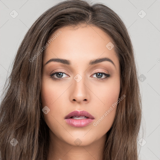 Neutral white young-adult female with long  brown hair and brown eyes