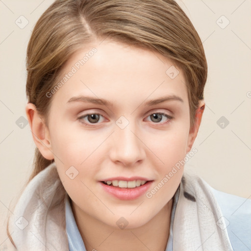 Joyful white young-adult female with short  brown hair and blue eyes