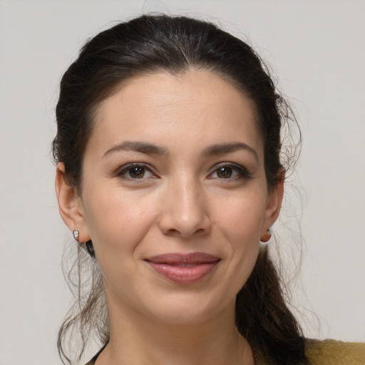 Joyful white young-adult female with long  brown hair and brown eyes