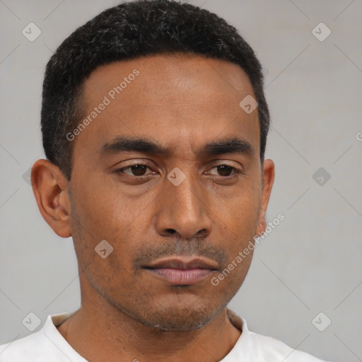 Neutral latino young-adult male with short  black hair and brown eyes