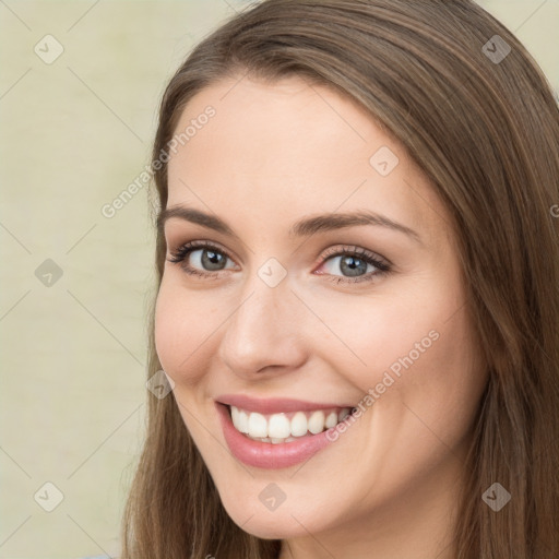 Joyful white young-adult female with long  brown hair and green eyes