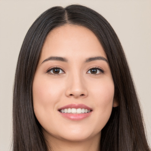 Joyful white young-adult female with long  black hair and brown eyes