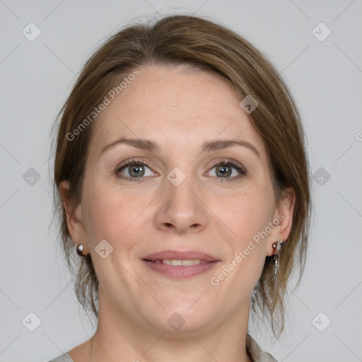 Joyful white adult female with medium  brown hair and grey eyes