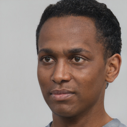 Neutral black young-adult male with short  black hair and brown eyes